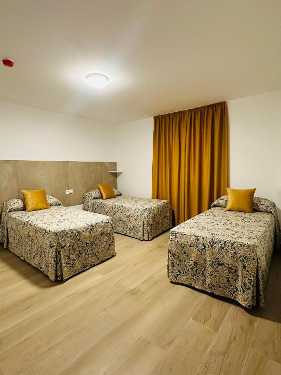 Postel nebo postele na pokoji v ubytování Hotel Quitagolpe