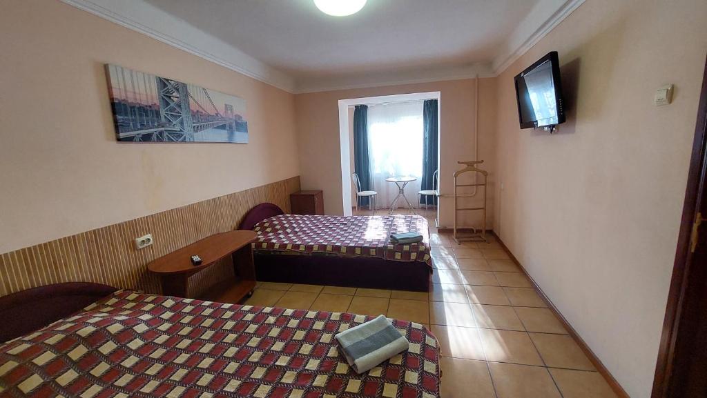 Postel nebo postele na pokoji v ubytování Hotel Desna KUT