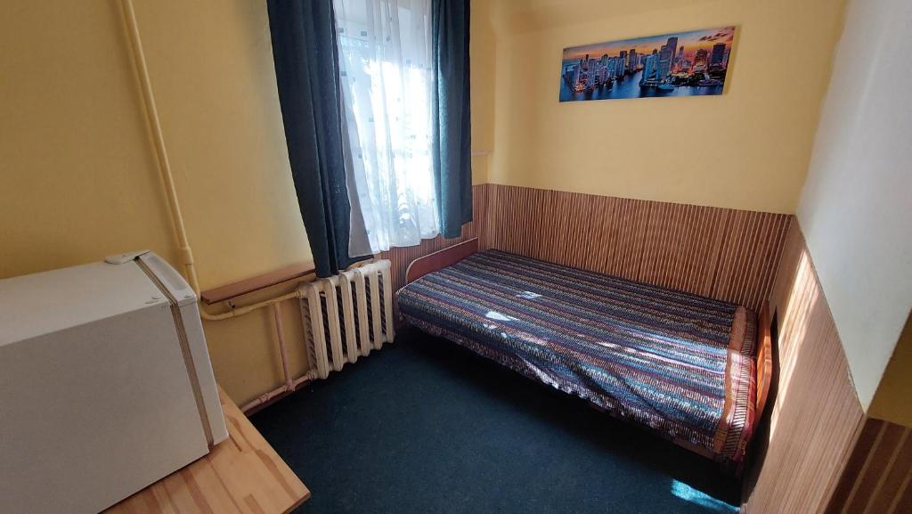 Postel nebo postele na pokoji v ubytování Hotel Desna KUT