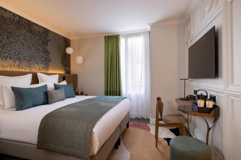 Postel nebo postele na pokoji v ubytování Hôtel L'Ormaie & Spa