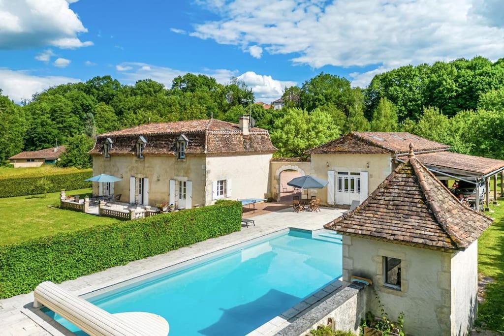 an estate with a swimming pool and a house at Beautiful French Villa, Sleeps 8, Private Pool & Starlink WIFI in Bourdeilles