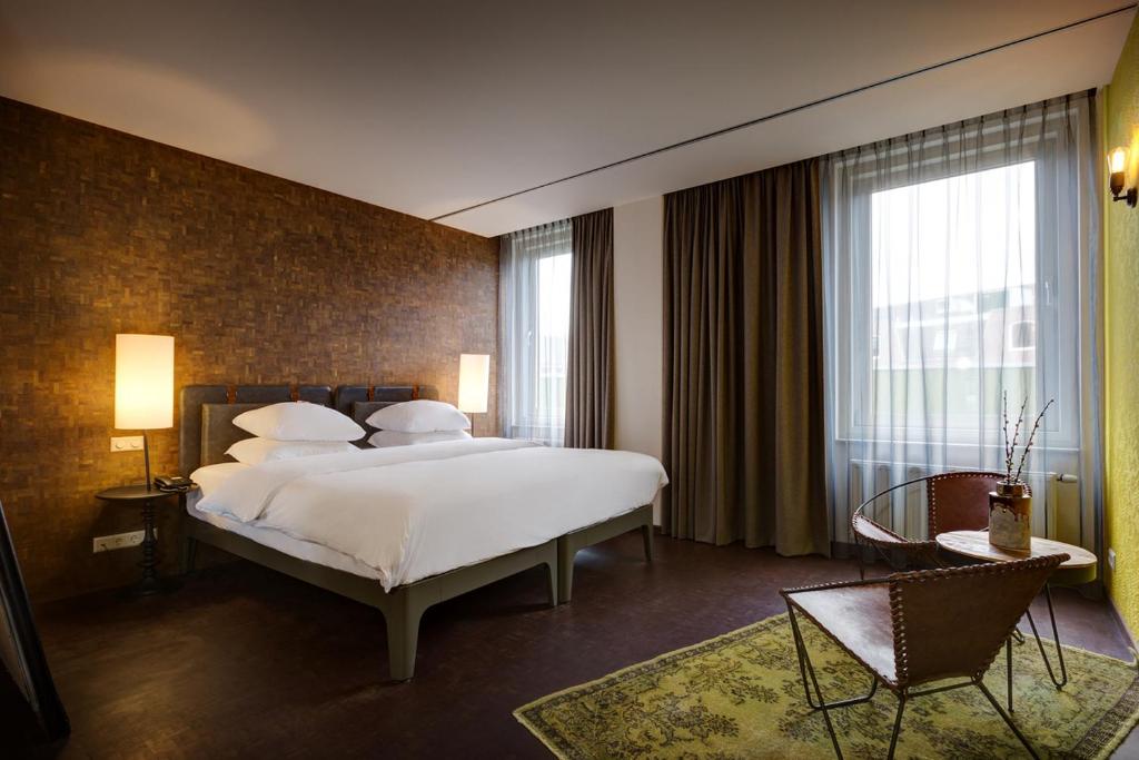 Postel nebo postele na pokoji v ubytování Hotel V Nesplein