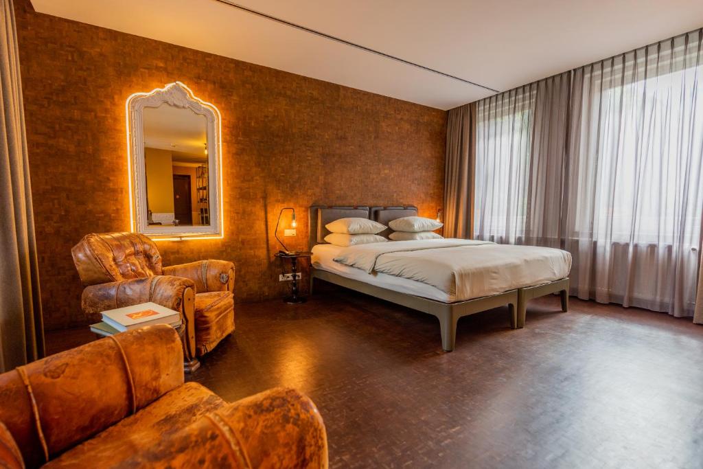 Postel nebo postele na pokoji v ubytování Hotel V Nesplein