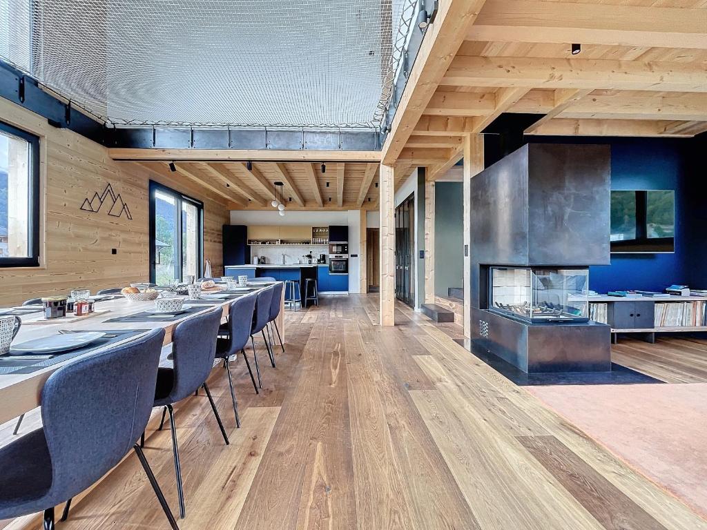 a large kitchen with a long table and chairs at Chalet Beli - Montriond - Centre village in Montriond