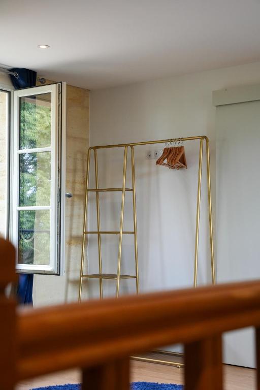 a bathroom with a ladder in the corner of a room at Château Vieux Clos Saint Émilion in Saint-Émilion