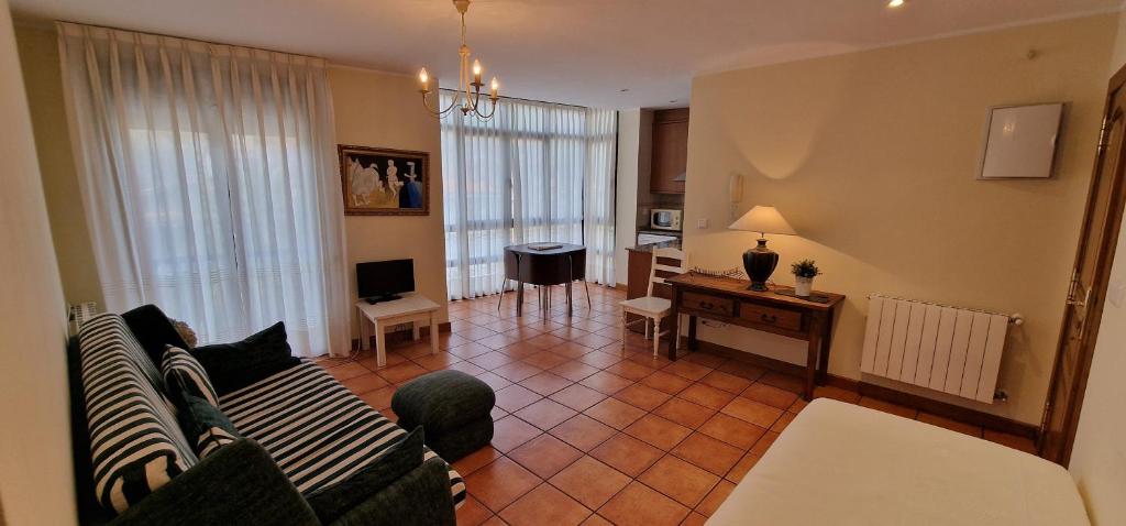 a living room with a couch and a table at La Palma de Cabrales - AT-1501-AS in Arenas de Cabrales