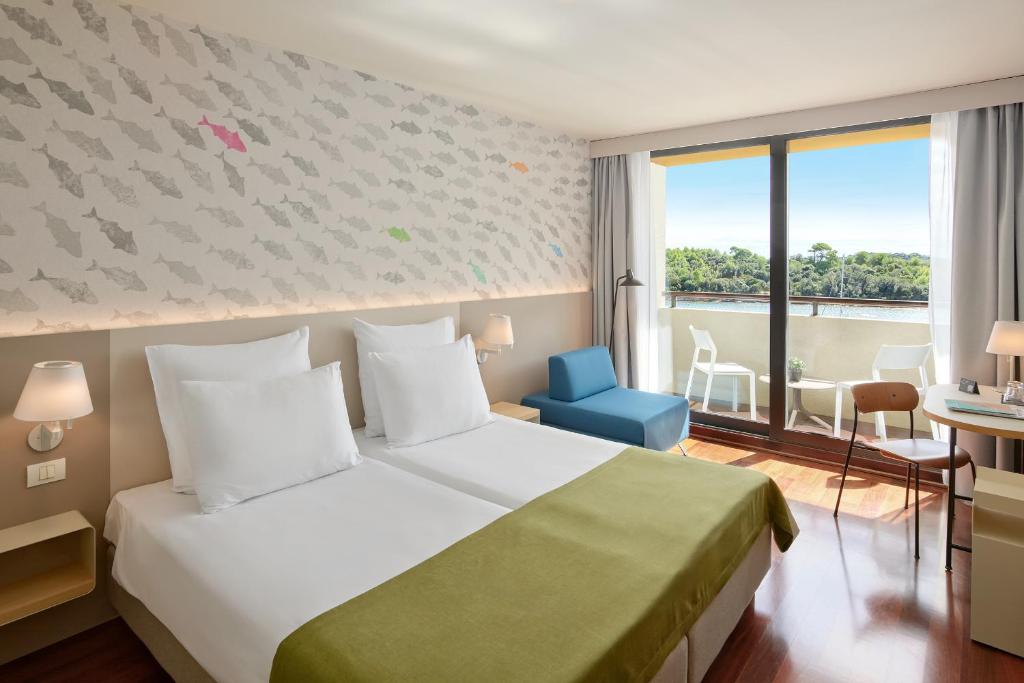 Postel nebo postele na pokoji v ubytování Maistra Select Island Hotel Istra