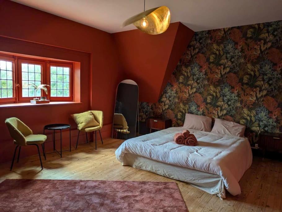 Postel nebo postele na pokoji v ubytování La Mariance