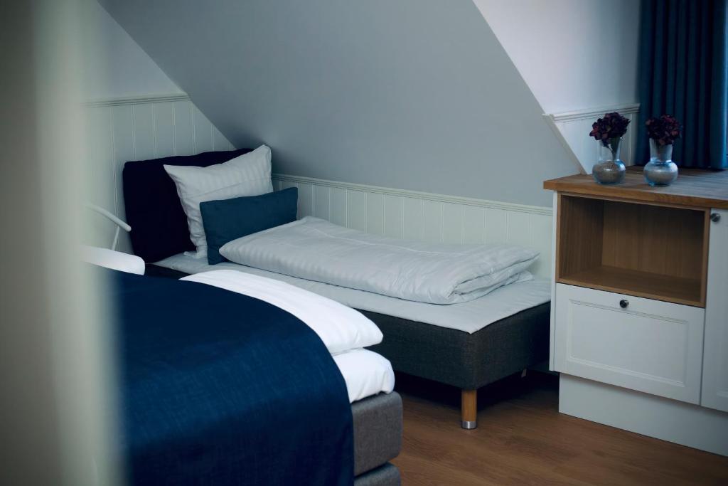 Postel nebo postele na pokoji v ubytování Plesners Badehotel