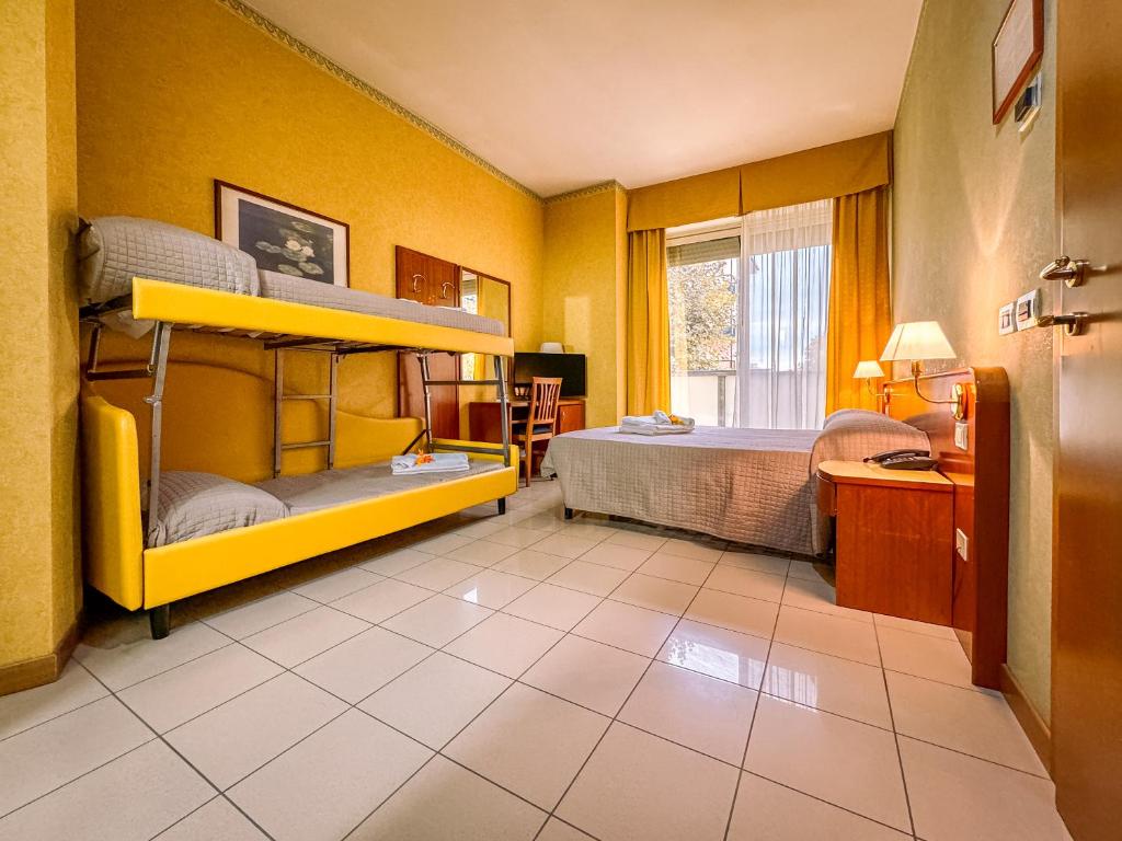 Postel nebo postele na pokoji v ubytování Hotel Remin Plaza
