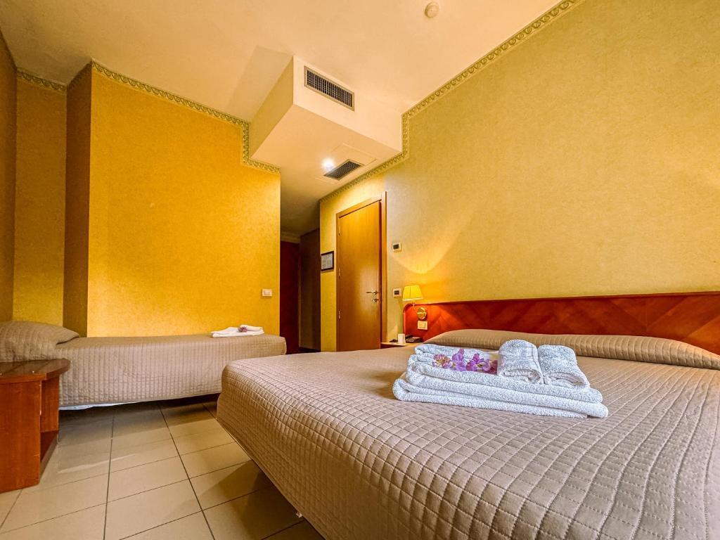 Postel nebo postele na pokoji v ubytování Hotel Remin Plaza