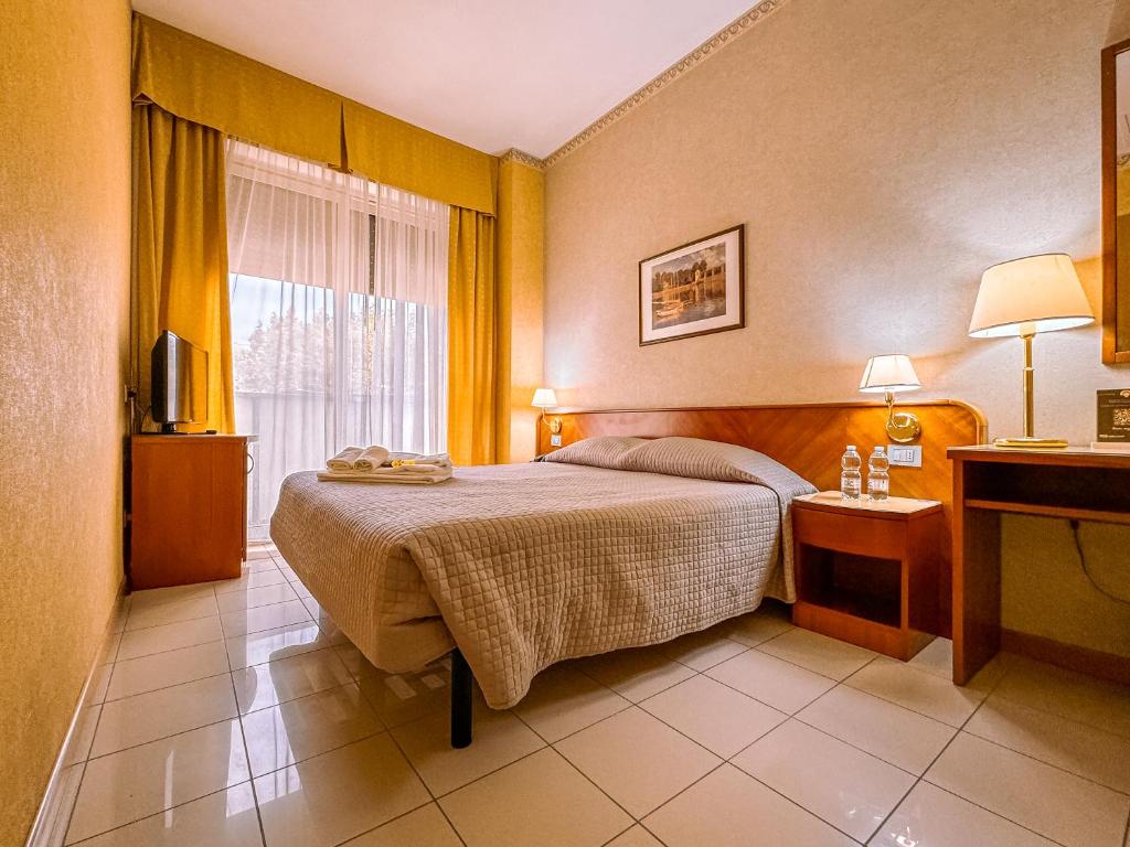 Postel nebo postele na pokoji v ubytování Hotel Remin Plaza