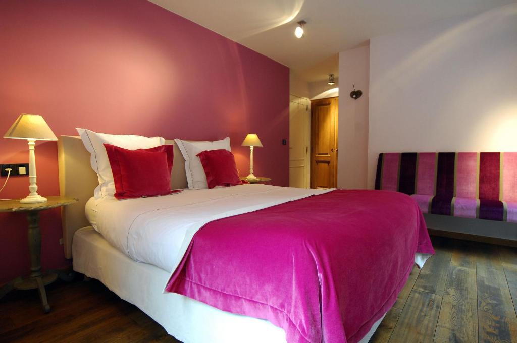 Postel nebo postele na pokoji v ubytování Hotel Saint-Amour