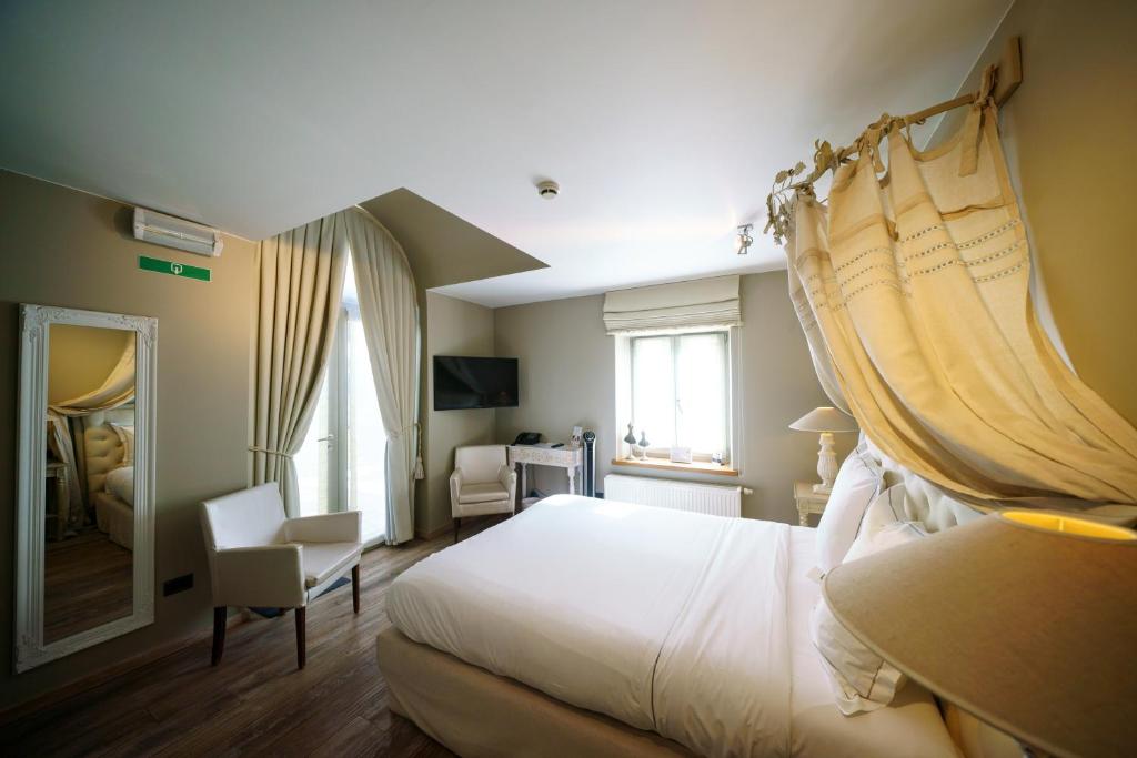 Postel nebo postele na pokoji v ubytování Hotel Saint-Amour