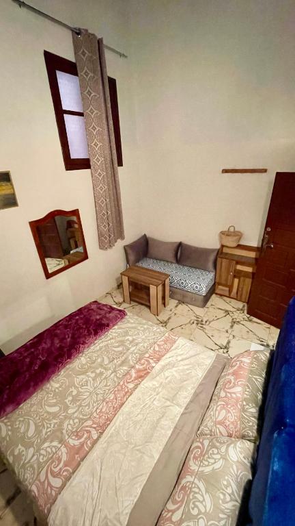 Postel nebo postele na pokoji v ubytování Riad Dar Al Manzah
