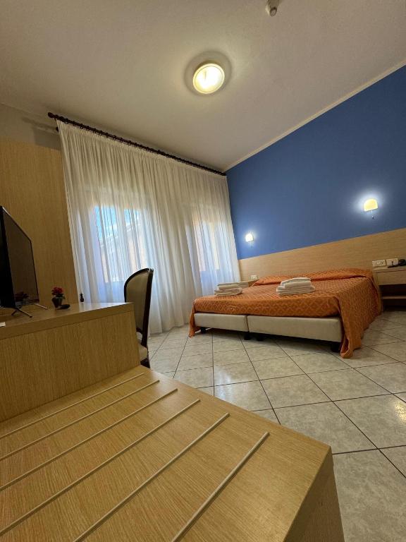TV a/nebo společenská místnost v ubytování Albergo La Posta Arezzo
