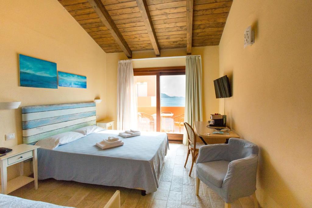 Postel nebo postele na pokoji v ubytování Hotel Costa Paradiso
