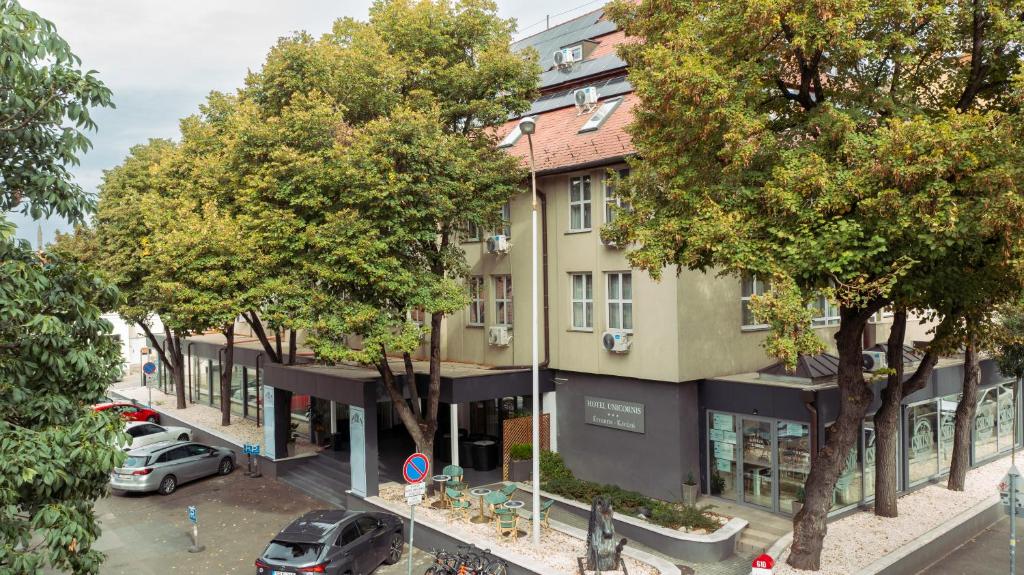 an overhead view of a building with cars parked on the street at Hotel Unicornis in Eger