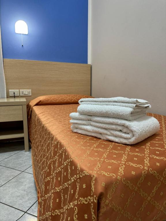 Postel nebo postele na pokoji v ubytování Albergo La Posta Arezzo