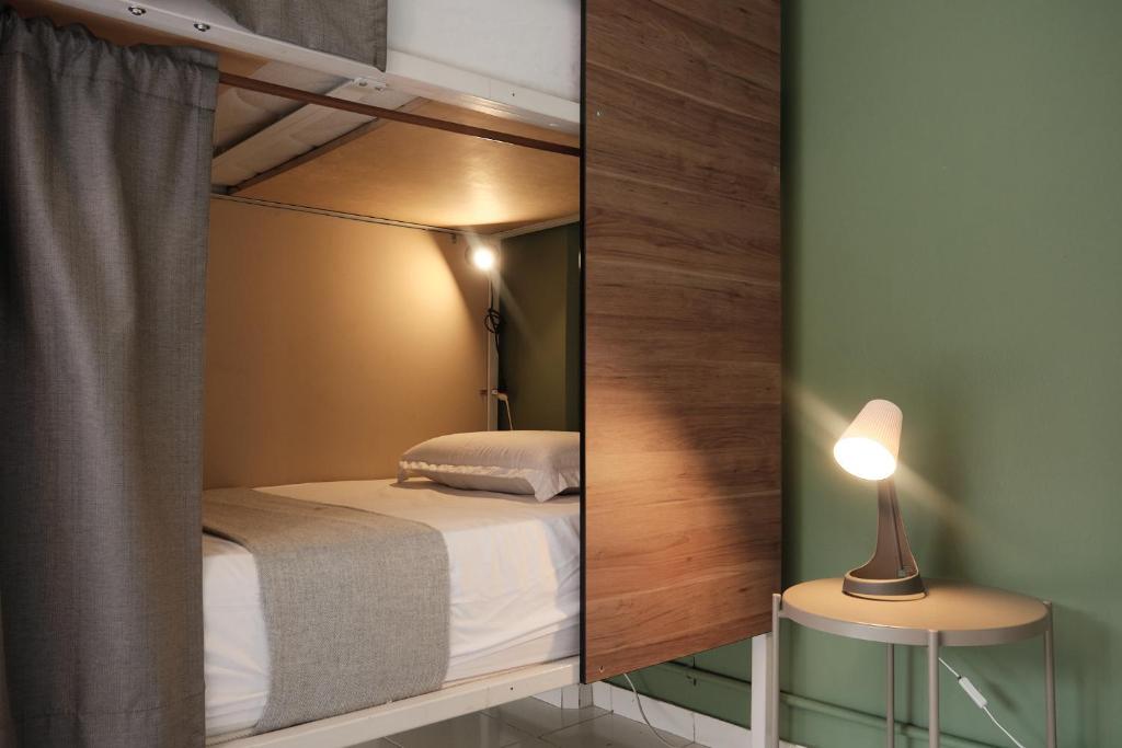 Postel nebo postele na pokoji v ubytování Nomadia Coliving Boutique