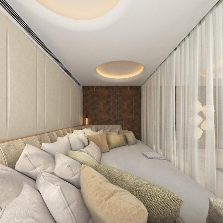 Postel nebo postele na pokoji v ubytování Seanergy Boutique & Spa Hotel