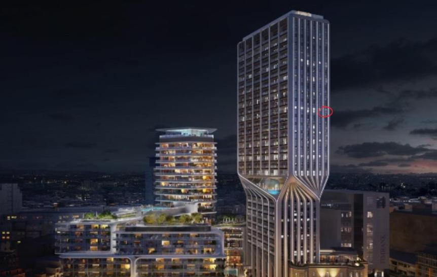 a tall skyscraper in a city at night at Apartment on Cloud Nine in Malta's Tallest Tower in St Julian's