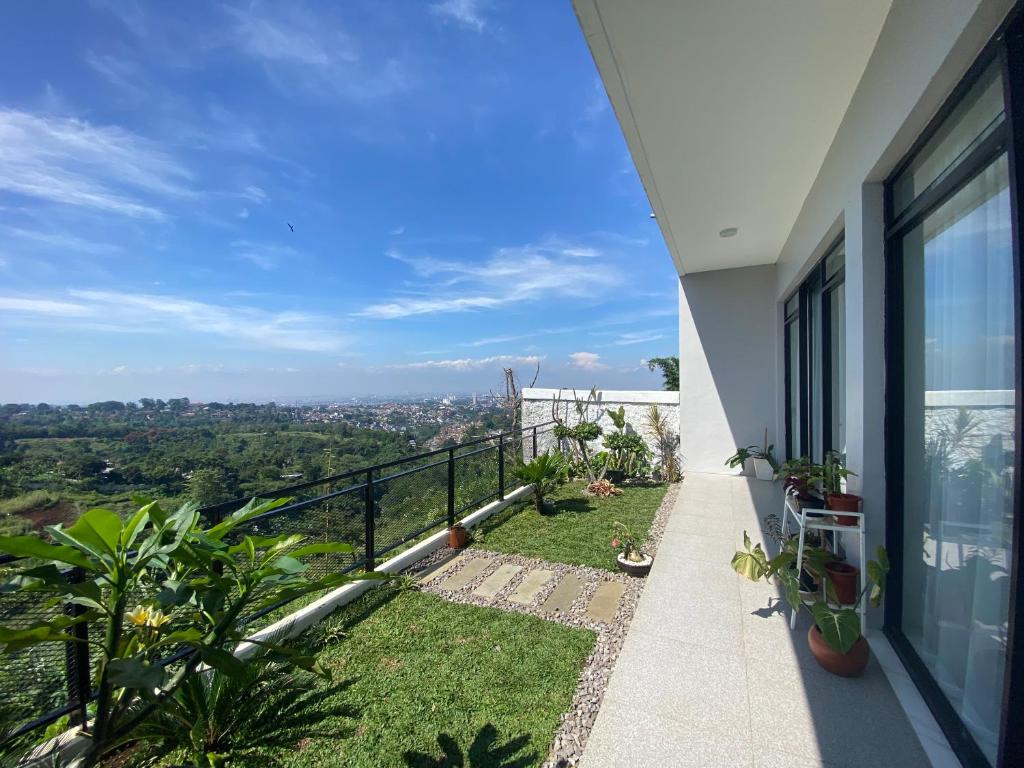 a balcony of a house with a view at Casa Revanaka Ciumbuleuit Bandung in Bandung