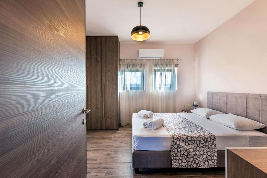Posteľ alebo postele v izbe v ubytovaní Marinas Villas