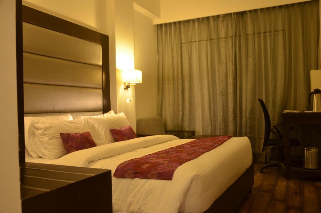 Postel nebo postele na pokoji v ubytování Veronica Hotel