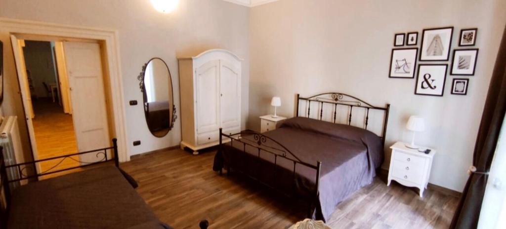 Una cama o camas en una habitación de Casa Principe Taranto "Intero appartamento"