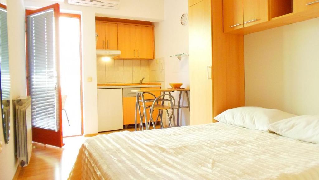 Postel nebo postele na pokoji v ubytování Apartments Bor