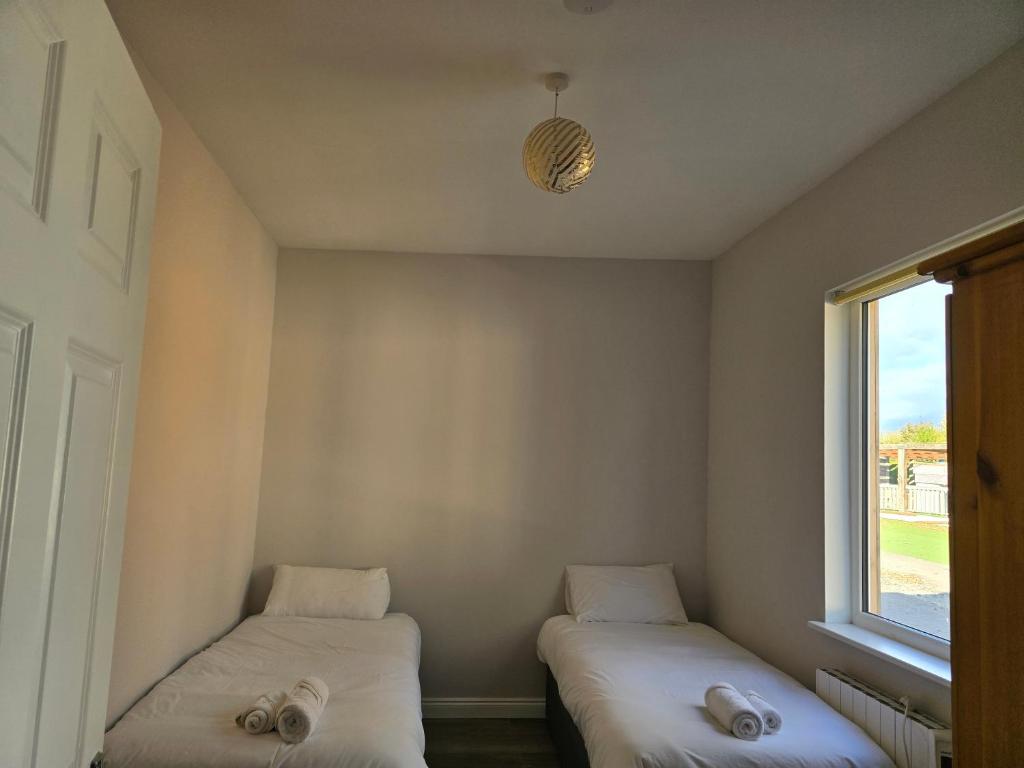 Postel nebo postele na pokoji v ubytování The Dutch Tulip Hotel