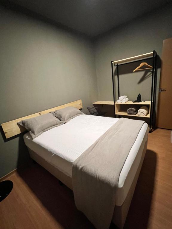 Postel nebo postele na pokoji v ubytování Reserva 1202 - Hospedagem