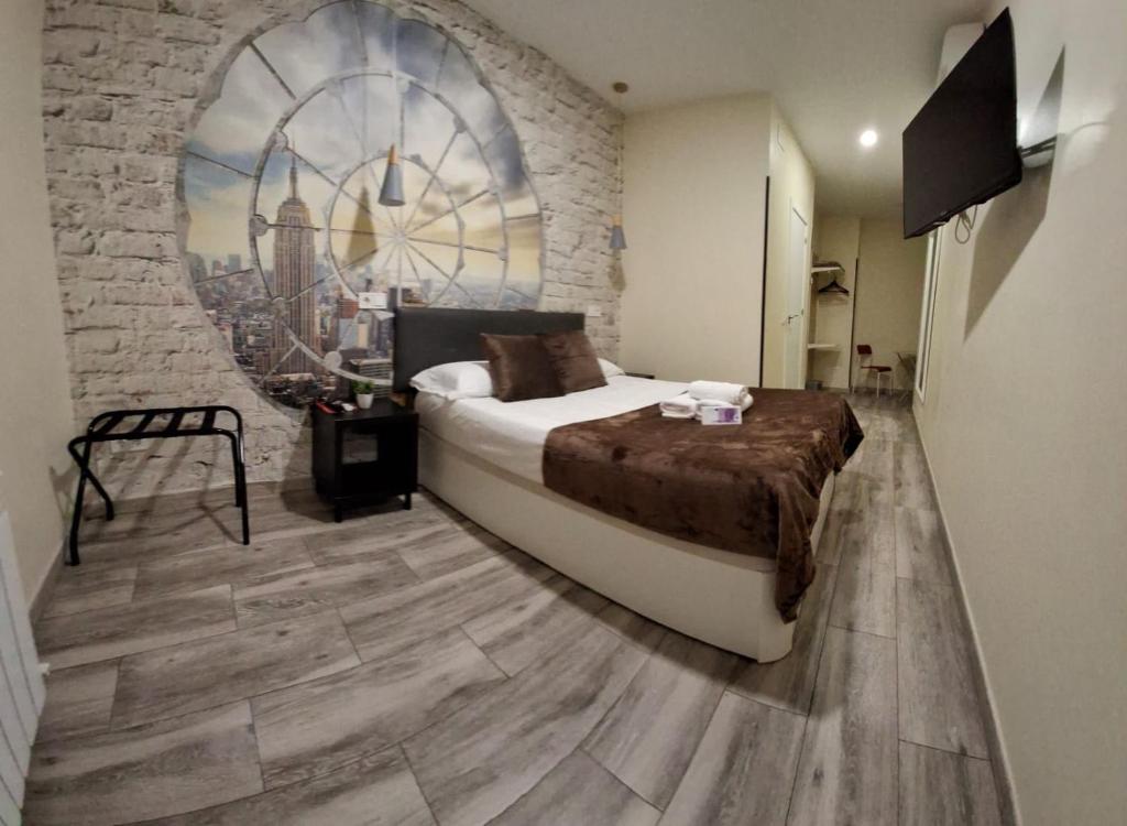 Ένα ή περισσότερα κρεβάτια σε δωμάτιο στο CH CRUZ MADRiD