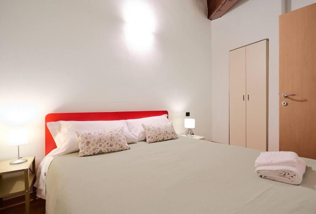 Posteľ alebo postele v izbe v ubytovaní Johnny Suites Bergamo Alta