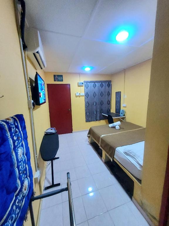 Postel nebo postele na pokoji v ubytování Irama Resort Amir YJS , Pantai Irama Bachok