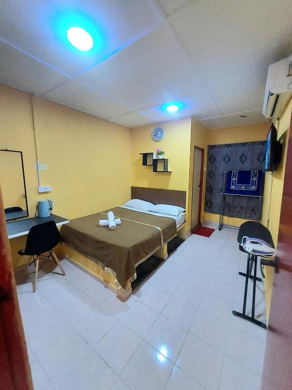 Postel nebo postele na pokoji v ubytování Irama Resort Amir YJS , Pantai Irama Bachok