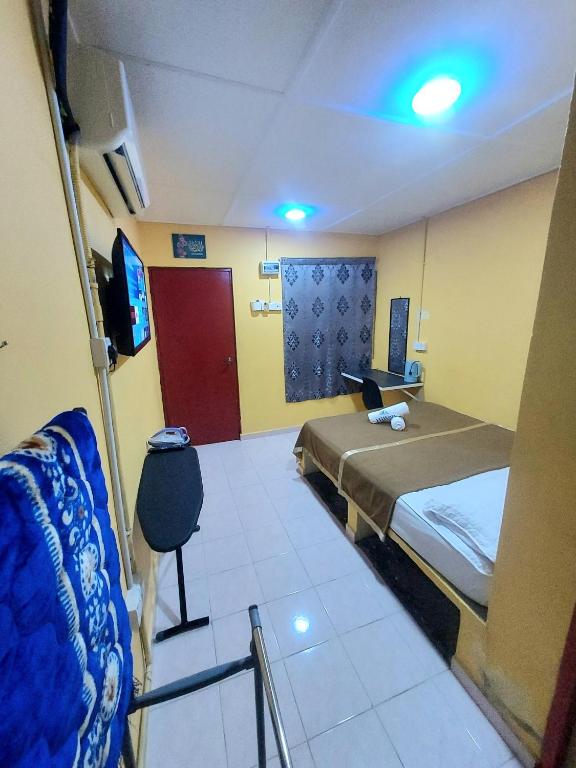 Postel nebo postele na pokoji v ubytování Irama Resort Amir YJS , Pantai Irama Bachok