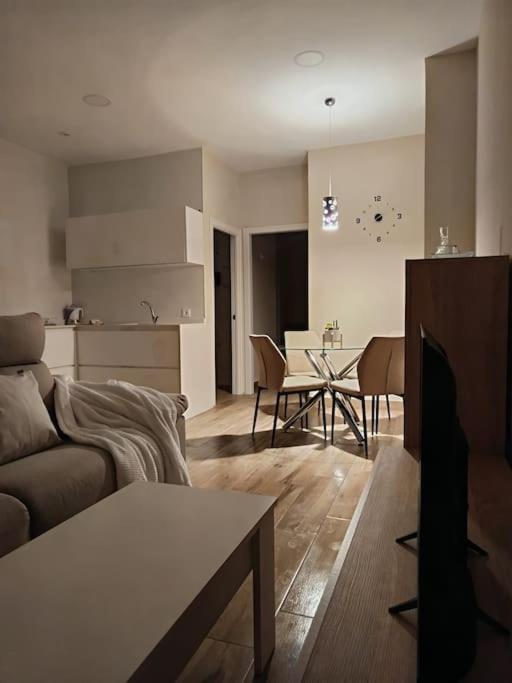 Hotel La Morada, a living room with a couch and a table at La Morada in Salamanca