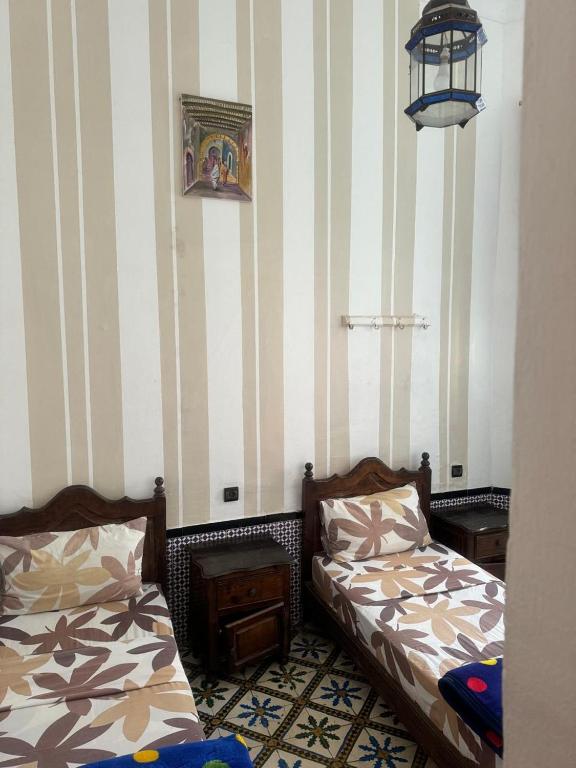 Postel nebo postele na pokoji v ubytování Hotel majestc