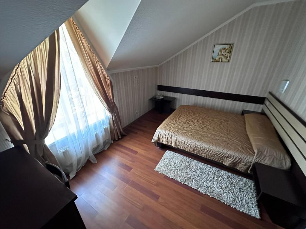 Postel nebo postele na pokoji v ubytování Mini-Hotel in Kharkiv