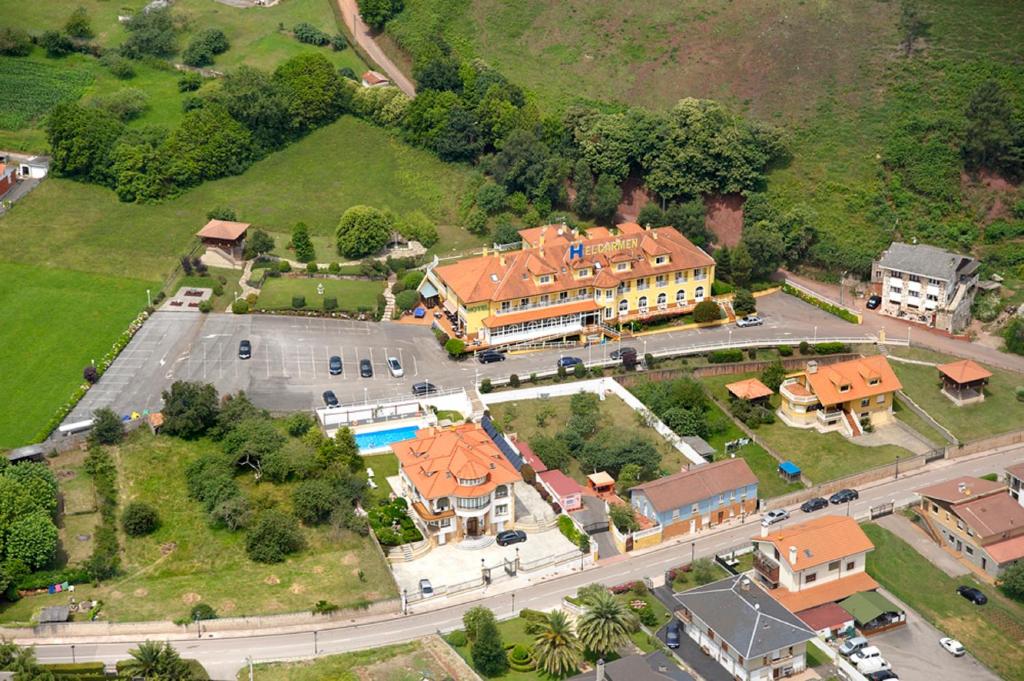 an aerial view of a building with a parking lot at Hotel y Casona El Carmen in Perlora