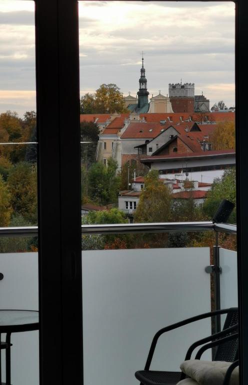 a view of a city from a window at Widokowy 1 in Sandomierz