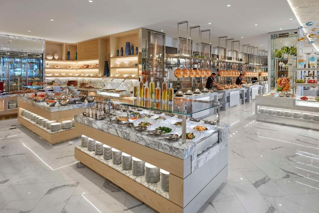 a bakery with a buffet of food on display at Crown Towers Perth in Perth