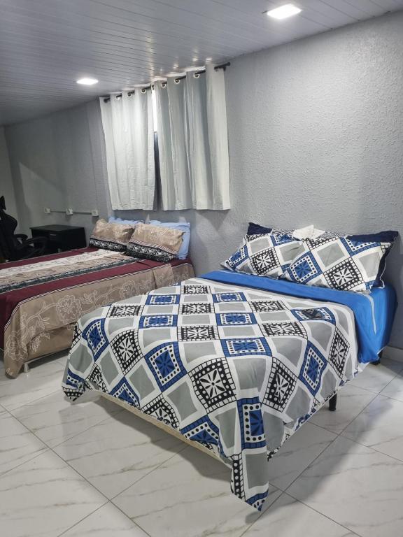 Postel nebo postele na pokoji v ubytování Stúdio andar superior, próximo ao hotel Rafain Palace
