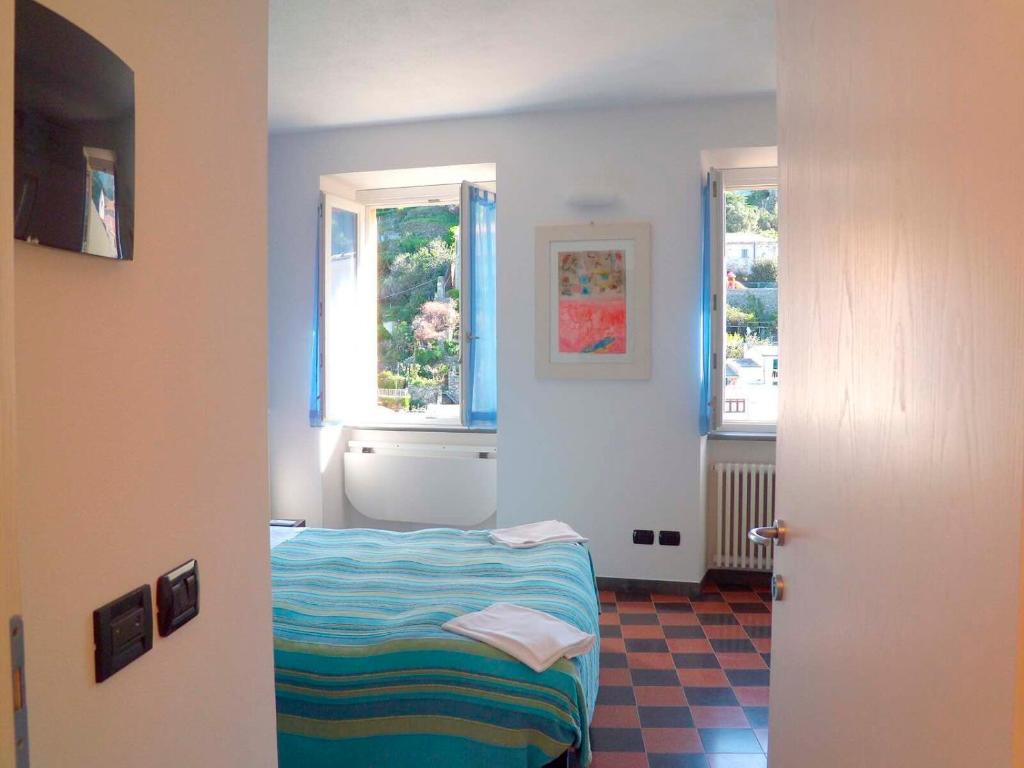 Postel nebo postele na pokoji v ubytování Hotel Gianni Franzi