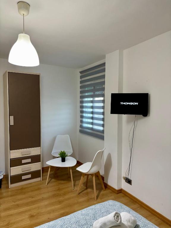 TV a/nebo společenská místnost v ubytování Casa Ubedí en pleno casco histórico