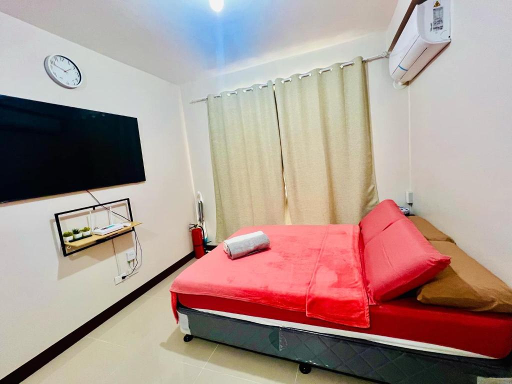 Llit o llits en una habitació de Saekyung Condo