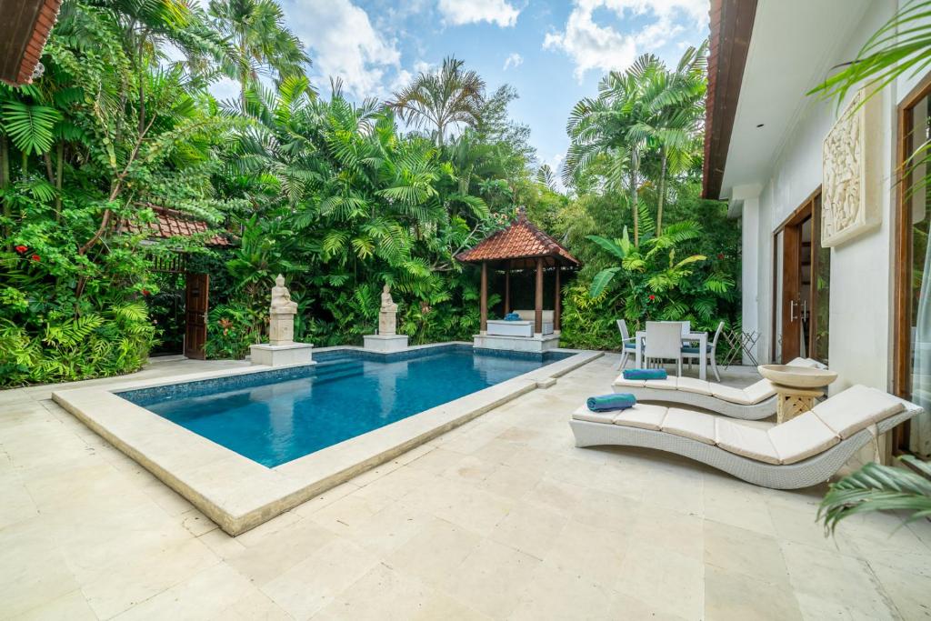 an image of a swimming pool in a villa at Villa Nemia Seminyak in Seminyak