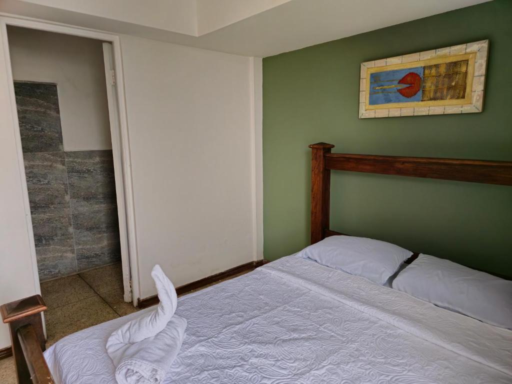 Postel nebo postele na pokoji v ubytování Haven Hotel